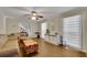 Inviting living room featuring wood floors, modern decor and large windows at 3563 Castleridge Dr, Tucker, GA 30084