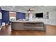 Living room with hardwood floors, a large gray couch, and lots of built in storage at 3563 Castleridge Dr, Tucker, GA 30084