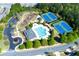 Aerial view showcasing community amenities, including a pool, playground, and tennis courts at 4125 Barnes Meadow Sw Rd, Smyrna, GA 30082