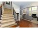 Open foyer with stairs and view of the living room with fireplace at 4125 Barnes Meadow Sw Rd, Smyrna, GA 30082