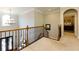 Hallway with chandelier, banister and door to bedroom at 4125 Barnes Meadow Sw Rd, Smyrna, GA 30082
