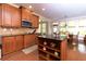 Well-appointed kitchen featuring wood cabinetry, granite countertops, and a functional center island at 4125 Barnes Meadow Sw Rd, Smyrna, GA 30082