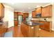 Open kitchen features granite countertops, wood cabinets, and stainless steel appliances at 4125 Barnes Meadow Sw Rd, Smyrna, GA 30082