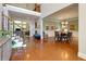 Open-concept living space with hardwood floors, staircase, and dining area, great for entertaining at 4125 Barnes Meadow Sw Rd, Smyrna, GA 30082