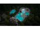 An aerial view shows the community pool, lazy river, and pool area with lounge chairs and mature trees at 159 Sunshower Rdg, Canton, GA 30114