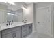 Bathroom with double sinks, gray cabinets, and a separate shower room at 159 Sunshower Rdg, Canton, GA 30114
