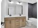 Modern bathroom with double sink vanity, black hardware, and black tile accent wall at 159 Sunshower Rdg, Canton, GA 30114