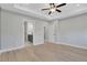 Large bedroom leading to an ensuite bathroom with light hardwood floors at 159 Sunshower Rdg, Canton, GA 30114