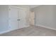 Bedroom with neutral paint, plush carpet, and a closet with double doors at 159 Sunshower Rdg, Canton, GA 30114
