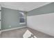 Bright bedroom with neutral paint, carpet flooring, wainscoting, and a window at 159 Sunshower Rdg, Canton, GA 30114