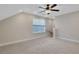 Bright bonus room features a ceiling fan, carpet flooring, and a window with blue shade at 159 Sunshower Rdg, Canton, GA 30114