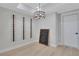 Elegant dining area features a chic chandelier and custom wine racks, perfect for entertaining at 159 Sunshower Rdg, Canton, GA 30114