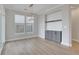 Dining room with a modern chandelier, a built-in cabinet, and large windows at 159 Sunshower Rdg, Canton, GA 30114