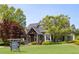 Community house with sales office featuring beautifully landscaped grounds at 159 Sunshower Rdg, Canton, GA 30114