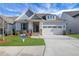Charming home featuring manicured lawn, stone accents, attached two car garage and inviting entryway at 159 Sunshower Rdg, Canton, GA 30114