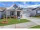 Charming home featuring manicured lawn, stone accents, attached two car garage and inviting entryway at 159 Sunshower Rdg, Canton, GA 30114