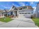 Charming home featuring manicured lawn, stone accents, attached two car garage and inviting entryway at 159 Sunshower Rdg, Canton, GA 30114