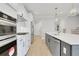Gourmet kitchen with stainless steel appliances, quartz countertops, and gray cabinetry, ready for culinary adventures at 159 Sunshower Rdg, Canton, GA 30114