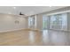 Bright living room with recessed lighting, hardwood floors and access to the outdoor living spaces at 159 Sunshower Rdg, Canton, GA 30114