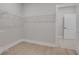 Spacious walk-in closet with wire shelving and light wood flooring at 159 Sunshower Rdg, Canton, GA 30114