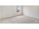 Carpeted bedroom with large window providing natural light and neighborhood views at 277 Ralph David Abernathy Blvd, Atlanta, GA 30312