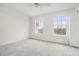 Inviting bedroom with plush carpeting and natural light from two large windows at 277 Ralph David Abernathy Blvd, Atlanta, GA 30312