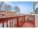 Inviting outdoor deck space with red railings perfect for relaxing or entertaining guests with neighborhood views at 277 Ralph David Abernathy Blvd, Atlanta, GA 30312