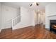 Open-concept living room featuring hardwood floors and a cozy fireplace at 277 Ralph David Abernathy Blvd, Atlanta, GA 30312