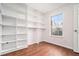 Well-lit office with laminate floors, custom built-in shelving, and large windows at 277 Ralph David Abernathy Blvd, Atlanta, GA 30312