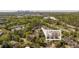 Aerial view of a townhouse complex surrounded by trees, with a city skyline visible in the distance at 2827 Overlook Ne Trce, Atlanta, GA 30324