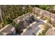 Aerial view of townhomes surrounded by trees and foliage with a parking lot in the foreground at 2827 Overlook Ne Trce, Atlanta, GA 30324