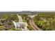 Stunning aerial view of a townhouse in a neighborhood surrounded by lush greenery, with the city skyline in the background at 2827 Overlook Ne Trce, Atlanta, GA 30324