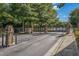 Community entrance featuring ornate iron gates and brick pillars at 2827 Overlook Ne Trce, Atlanta, GA 30324