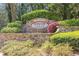 Close up of stone community sign for Overlook at Lenox with flowering bushes at 2827 Overlook Ne Trce, Atlanta, GA 30324