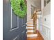 Inviting entryway with wood floors, stairs with rod iron spindles, and a welcoming wreath on the front door at 2827 Overlook Ne Trce, Atlanta, GA 30324