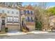 Charming townhome exterior with brick facade, garage, and well-manicured landscaping at 2827 Overlook Ne Trce, Atlanta, GA 30324