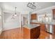 Stylish kitchen featuring wood cabinetry, granite countertops, stainless steel appliances, and a central island at 2827 Overlook Ne Trce, Atlanta, GA 30324