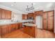 Gourmet kitchen with custom cabinets, granite countertops, stainless steel appliances, and a center island at 2827 Overlook Ne Trce, Atlanta, GA 30324