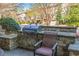 Outdoor cooking area with built-in grill and stone accents, perfect for entertaining at 2827 Overlook Ne Trce, Atlanta, GA 30324