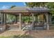 Inviting covered outdoor living area with stone fireplace and comfortable seating at 2827 Overlook Ne Trce, Atlanta, GA 30324