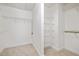 Walk-in closet featuring built-in shelving and ample storage space for an organized wardrobe at 2827 Overlook Ne Trce, Atlanta, GA 30324