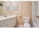 Well-lit bathroom featuring a white vanity, toilet, and tiled shower/tub combination at 4030 Palisades Main Nw, Kennesaw, GA 30144