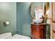 Stylish powder room featuring a vessel sink, marble floors, and bronze fixtures at 4030 Palisades Main Nw, Kennesaw, GA 30144