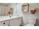 Bathroom featuring a vanity with sink, toilet, and mirrored medicine cabinet at 4030 Palisades Main Nw, Kennesaw, GA 30144
