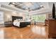 Spacious primary bedroom with large windows, tray ceiling, and hardwood floors at 4030 Palisades Main Nw, Kennesaw, GA 30144