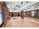 Bright yoga room featuring stone accent walls, wood floors, and mirrored wall at 4030 Palisades Main Nw, Kennesaw, GA 30144