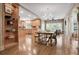 Dining area with hardwood floors adjacent to kitchen with chandelier lighting at 4030 Palisades Main Nw, Kennesaw, GA 30144