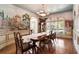 Refined dining room with decorative mural, traditional table, and hardwood floors at 4030 Palisades Main Nw, Kennesaw, GA 30144