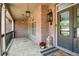 Charming front porch detailed with stone flooring and lantern-style lighting fixtures at 4030 Palisades Main Nw, Kennesaw, GA 30144