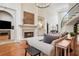 Spacious living room with fireplace, hardwood floors, and staircase leading to upper level at 4030 Palisades Main Nw, Kennesaw, GA 30144